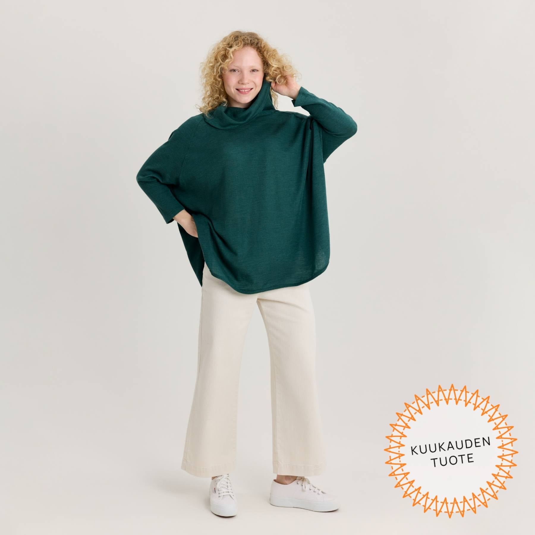Kuvassa vihreän värinen neuletunika. Valmistettu ylellisen pehmeästä merinosilkistä.