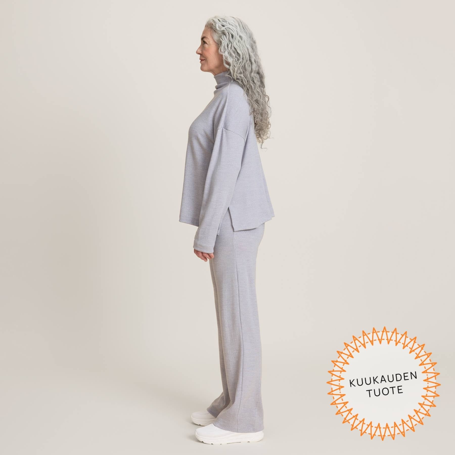 Harmaat rennot neulehousut kuvattuna sivuttain. Neulehousuissa on hyvä istuvuus ja laskeutuvuus.